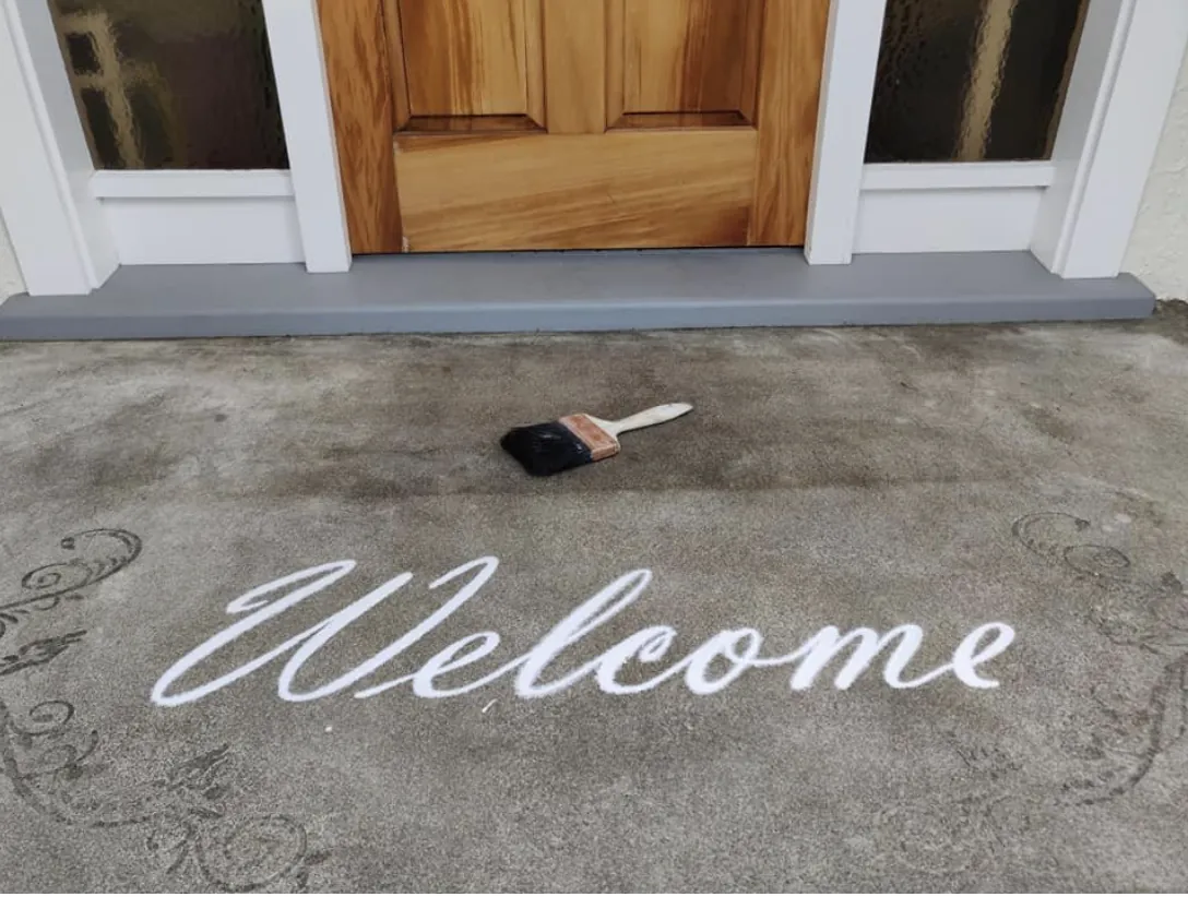 Welcome script engraved into a residential entry slab
