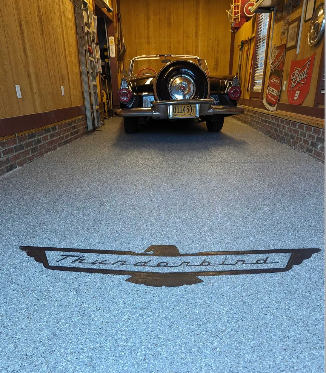 Thunderbird emblem engraved into a garage floor