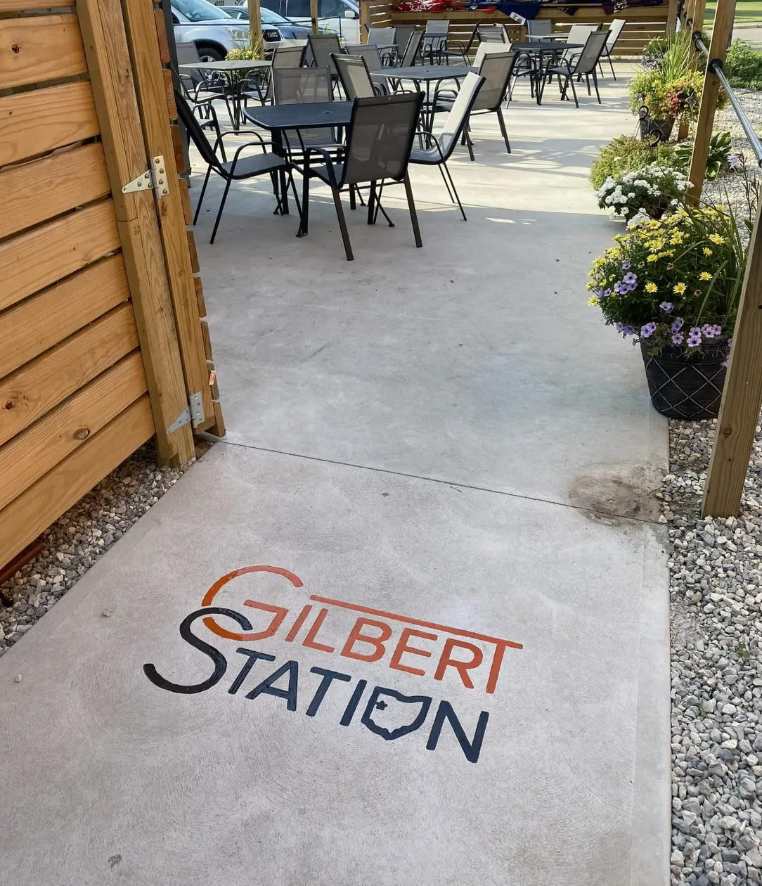 Gilbert Station logo engraved into a patio concrete slab