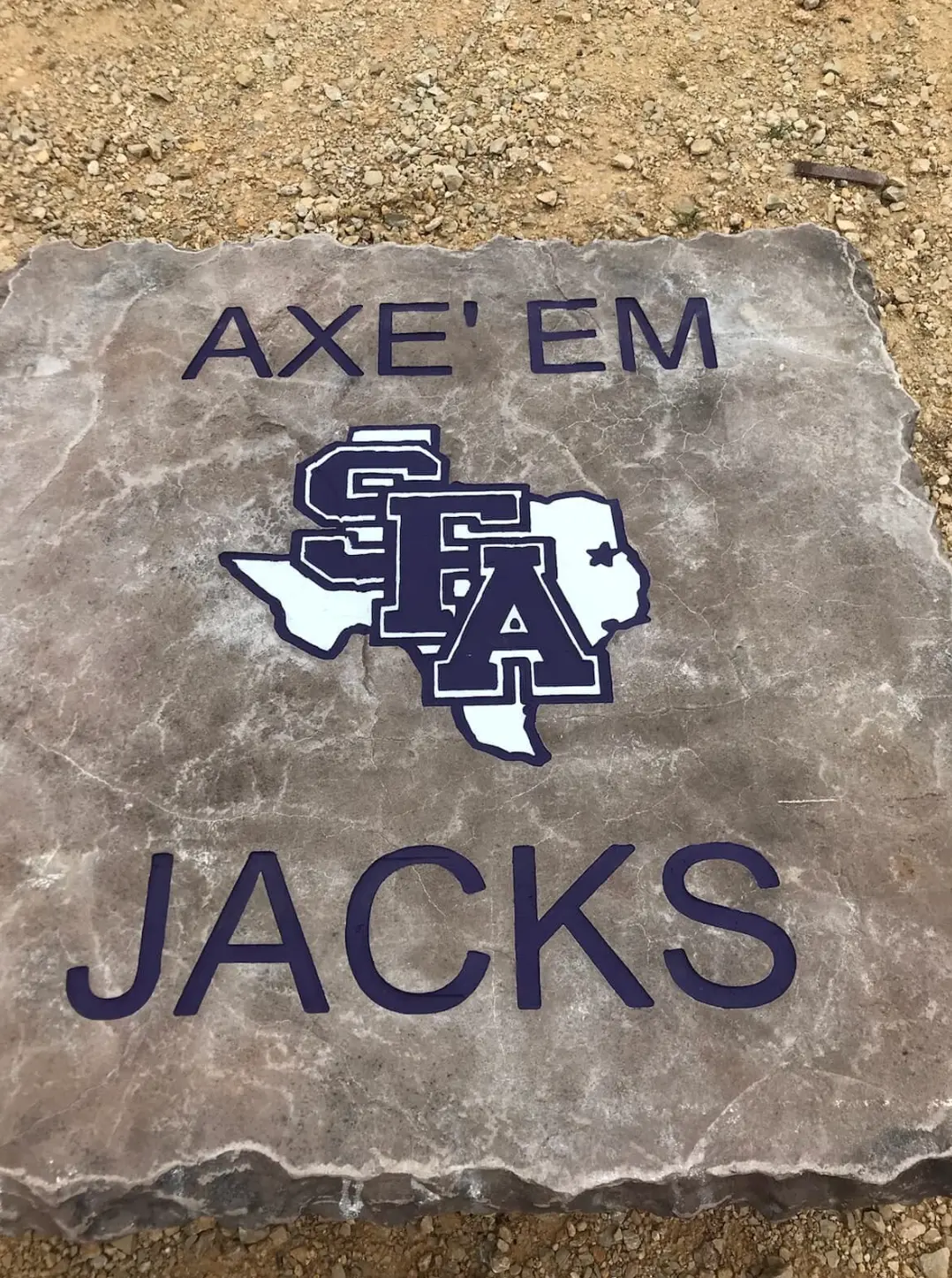 Axe Em Jacks SFA logo engraved and colored on a stone slab