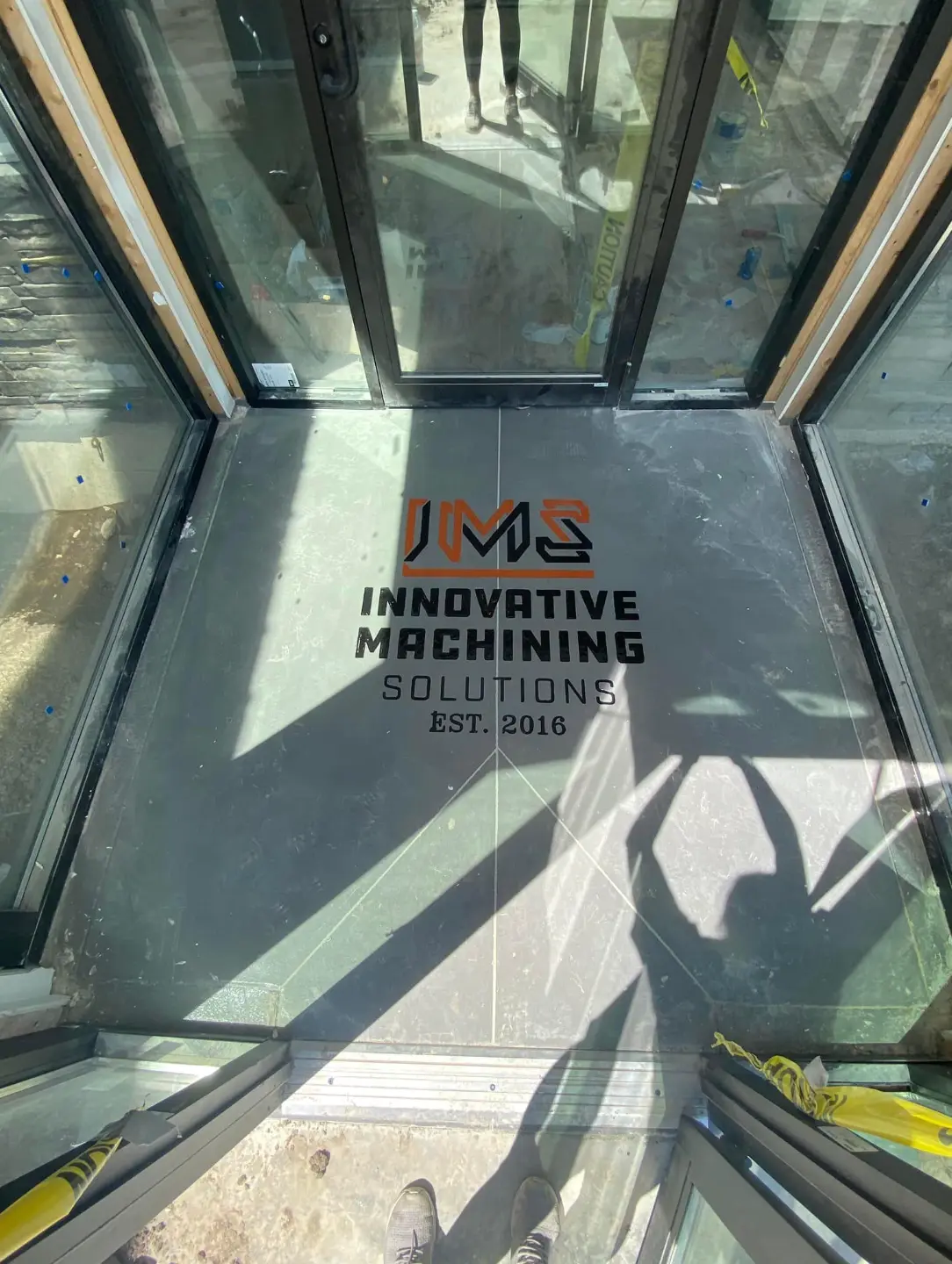 Innovative Machining Solutions logo engraved in an entryway floor